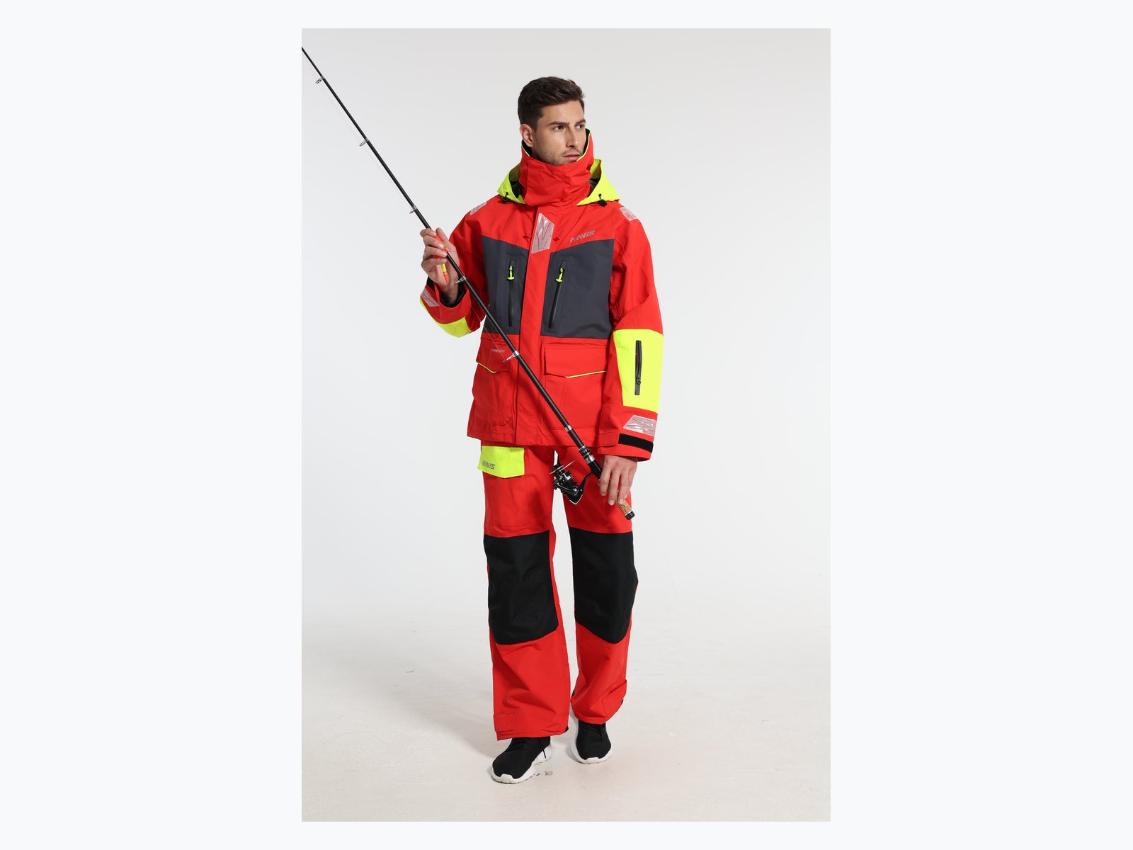 Red custom sailing jacket and bib pants model with fishing rod for marine foul weather gear OEM use case