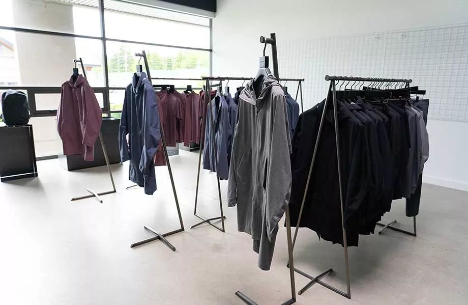 Technical outerwear sample room racks for OEM buyer review