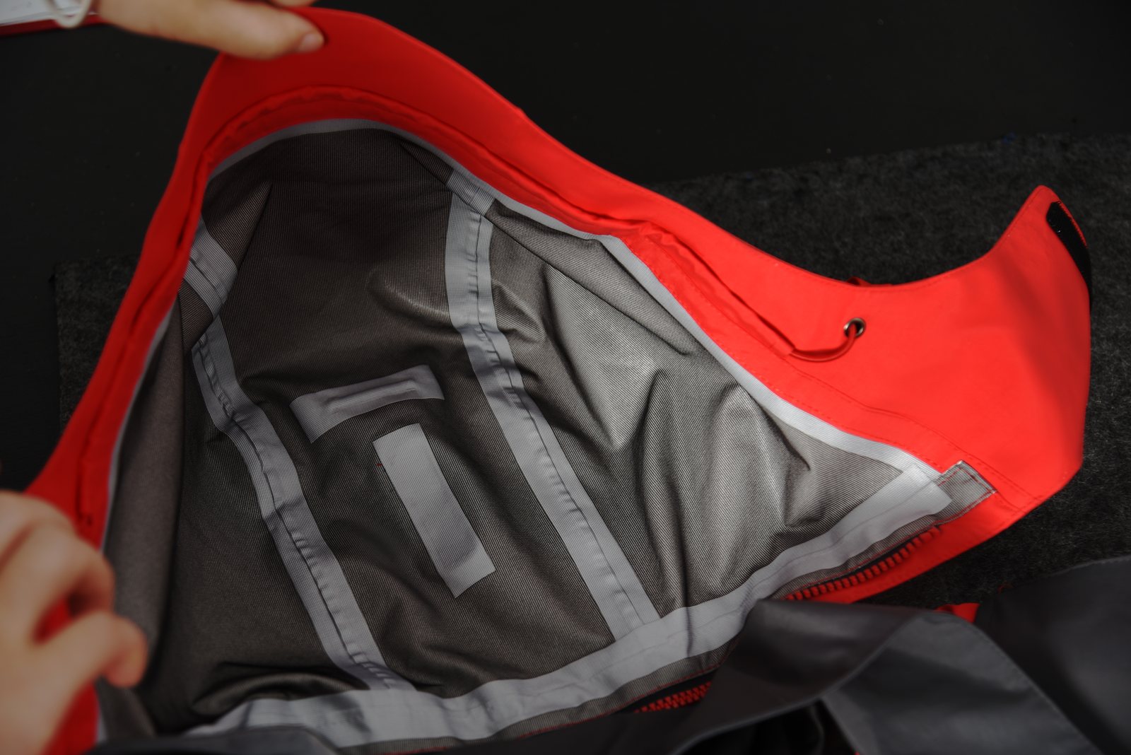 Waterproof shell jacket interior construction and seam tape detail for OEM review