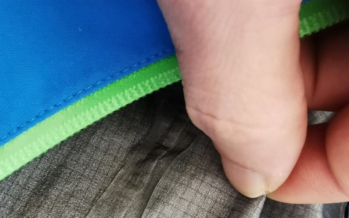 Waterproof breathable fabric and seam tape quality-control closeup